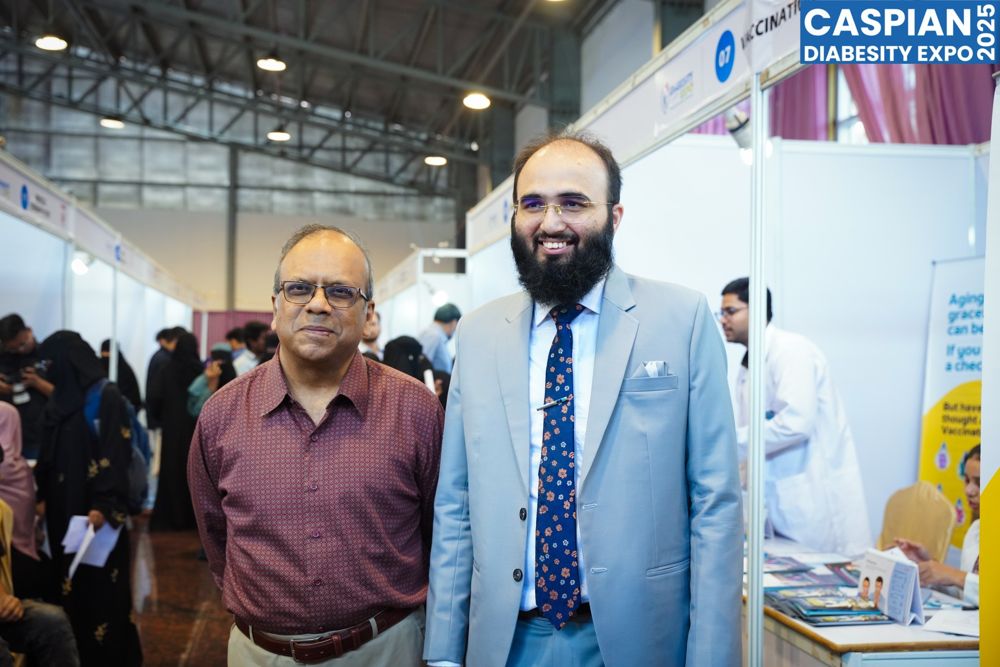 Visitors and doctors walking the exhibition stalls